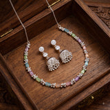 Pastel baguette stone necklace and jhumka earrings set in a wooden box
