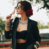 Close-up of layered silver-tone choker necklace on model