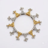 Dual tone gold and silver filigree triangle ghungroo charm bracelet laid flat in full circle on white background, clean product shot showing all triangle charms and ball bead links