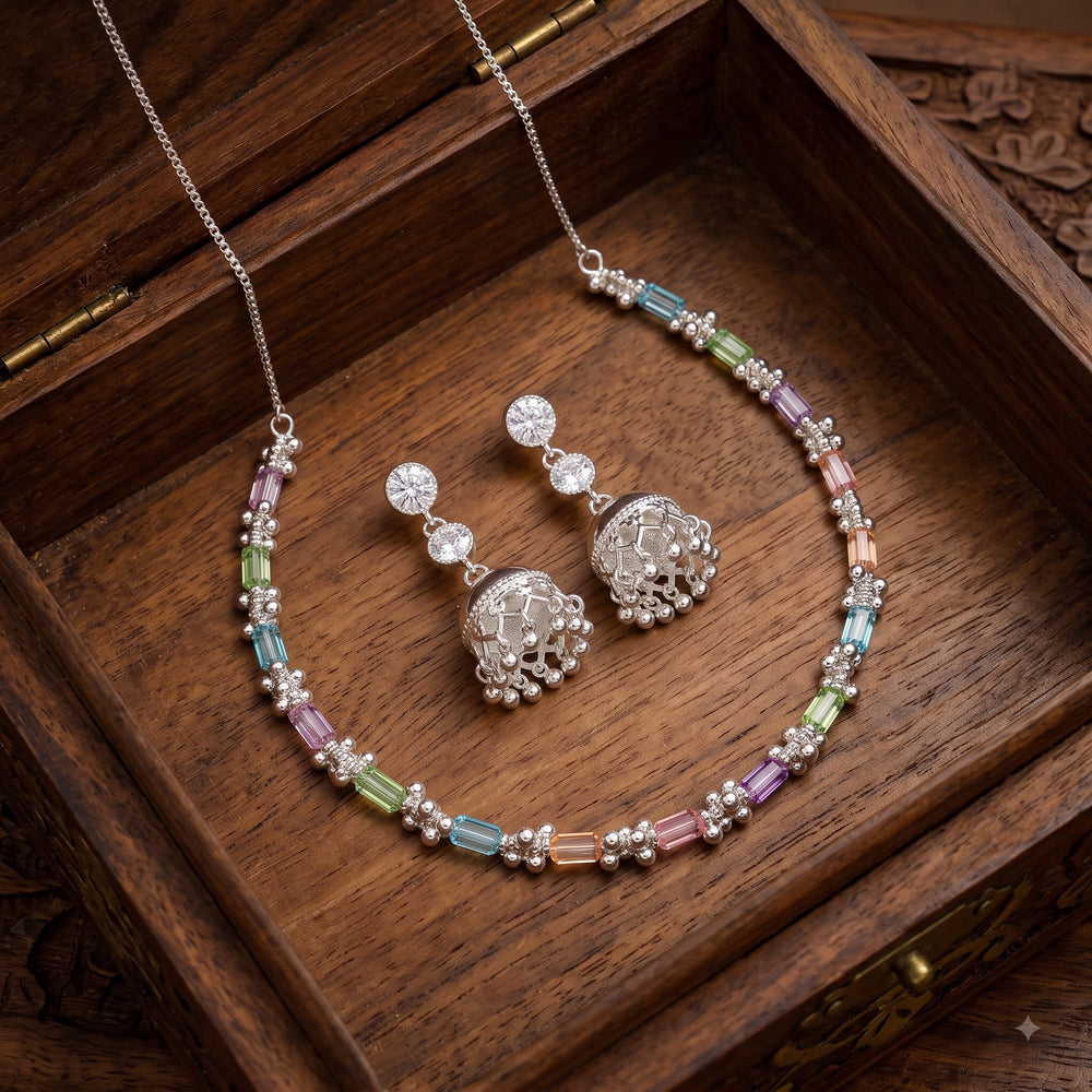 Pastel baguette stone necklace and jhumka earrings set in a wooden box