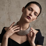 Model wearing silver-tone multi-layer ribbed choker necklace