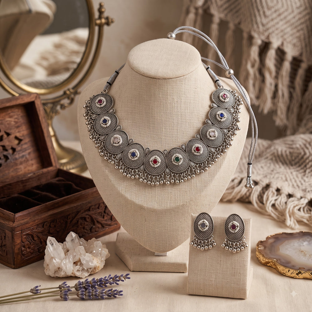 Oxidised silver-tone multicolour medallion choker necklace displayed on a jewellery stand