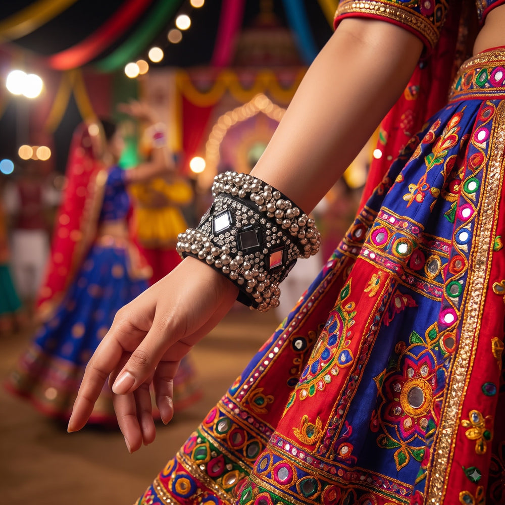 Indian model in black Navratri chaniya choli wearing oxidized silver mirror work ghungroo cuff bracelet, elegant hand gesture pose at Garba night event