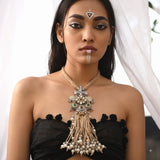 Model wearing the long tribal elephant pendant and tassel necklace