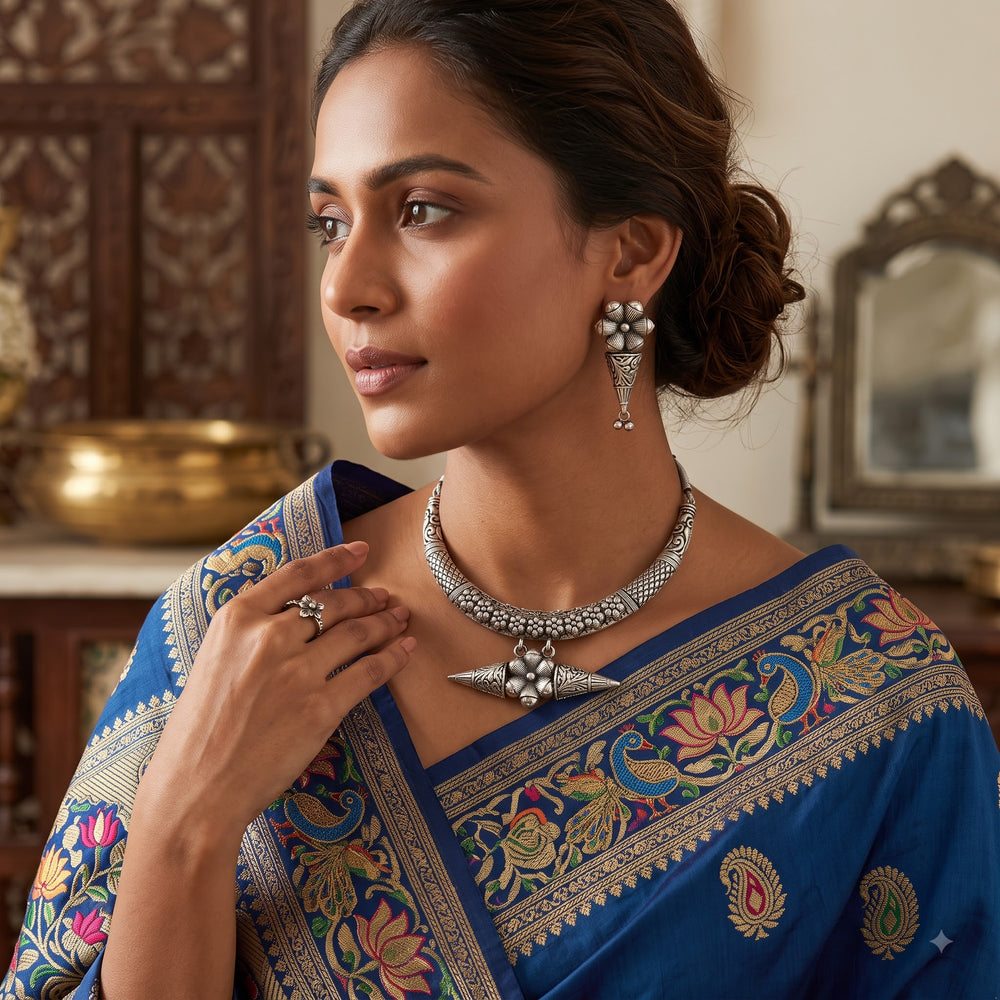 Model styling the oxidised hasli necklace and jhumka earrings