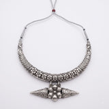 Silver-tone floral statement necklace on a white background