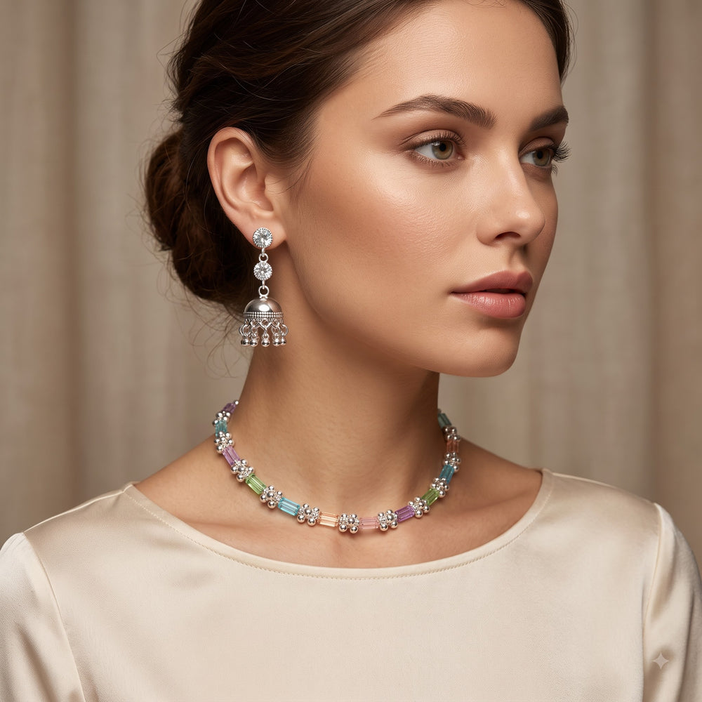 Close-up of model wearing the pastel baguette stone necklace