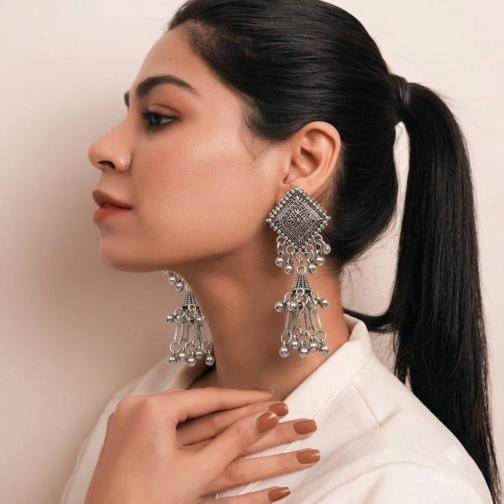 Oxidized silver diamond square chandelier jhumka earrings on grey silk with river stones and freshwater pearls, product flat lay